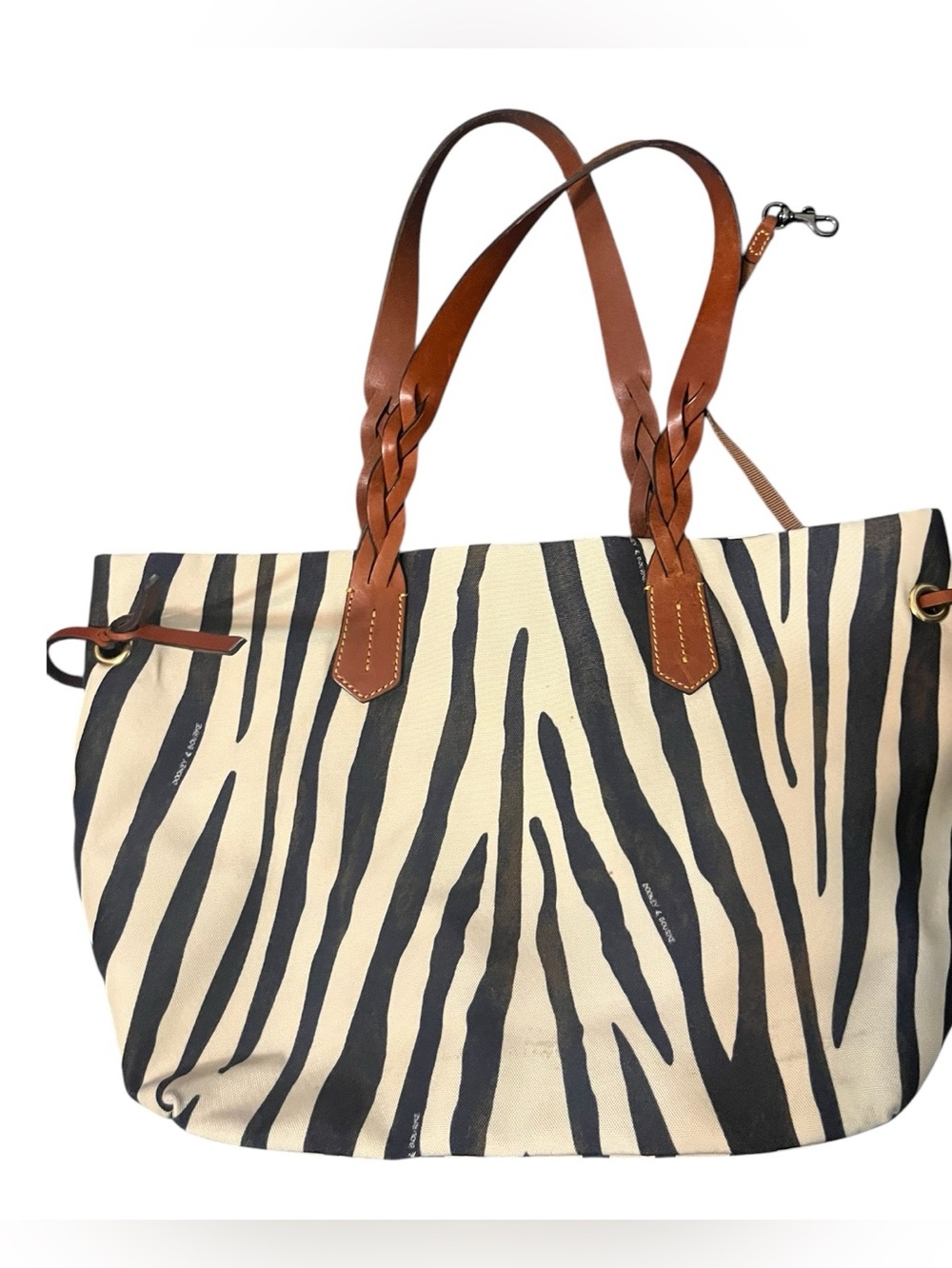 Dooney & Bourke Large tote bag, bold zebra print and braided leather handles.